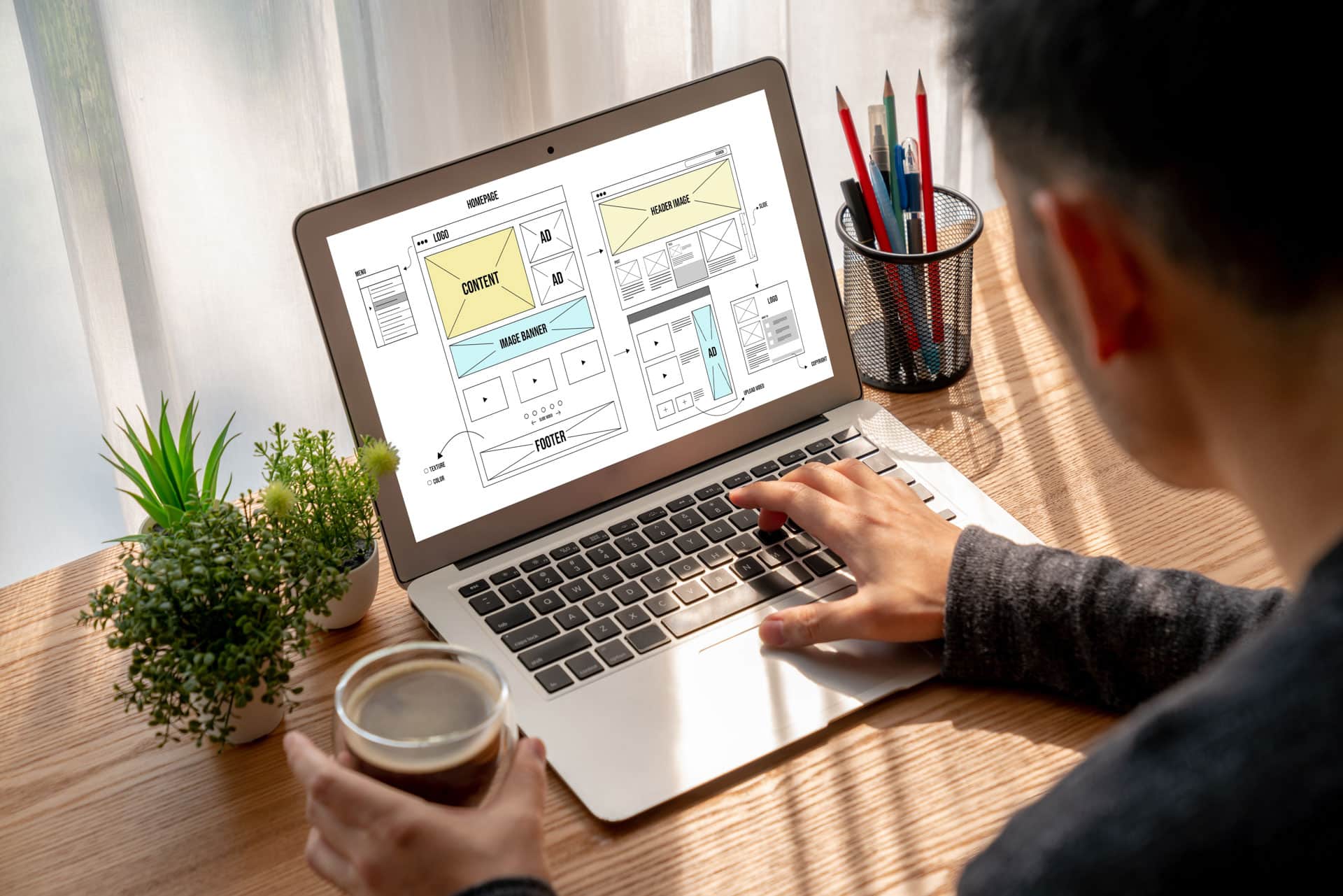 Guy on laptop designing website